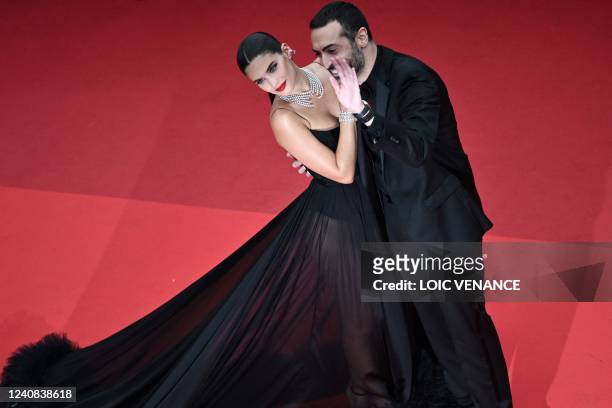 Portuguese model Sara Sampaio and Saudi film producer Mohammed al-Turki arrive for the screening of the film "Forever Young " at the 75th edition of...