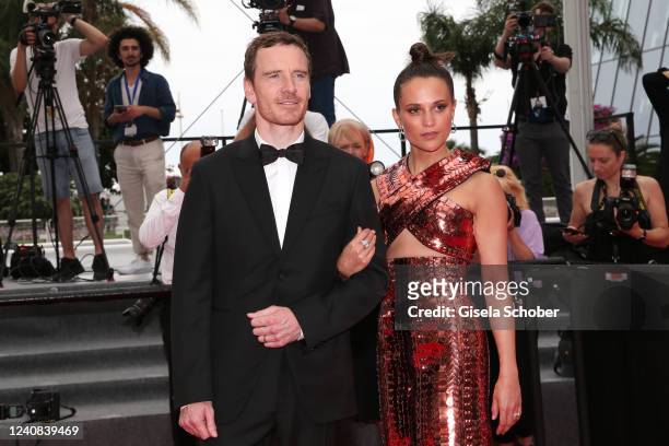 German-born Irish actor Michael Fassbender and Swedish actress Alicia Vikander attend the screening of "Holy Spider" during the 75th annual Cannes...