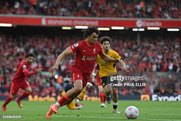 Liverpool's English defender Trent Alexander-Arnold controls the ball during the English Premier League football match between Liverpool and...