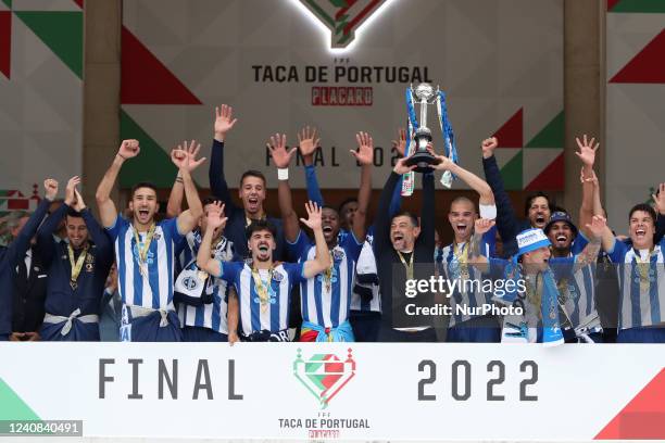 Porto's head coach Sergio Conceicao and team players celebrate with their trophy after winning the Portugal Cup Final football match between FC Porto...