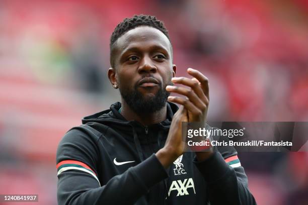 Divock Origi of Liverpool applauds at the end of the Premier League match between Liverpool and Wolverhampton Wanderers at Anfield on May 22, 2022 in...