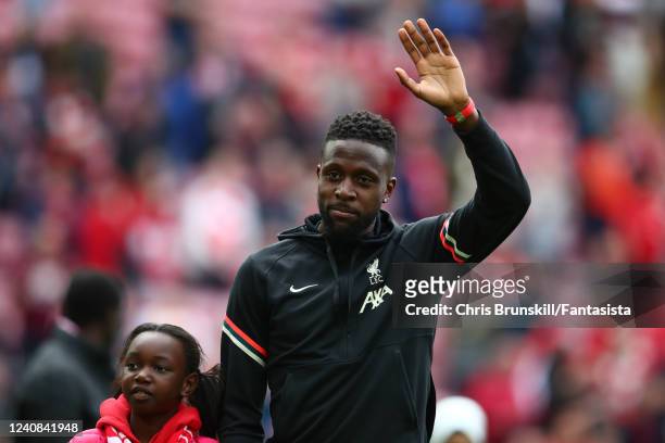 Divock Origi of Liverpool waves at the end of the Premier League match between Liverpool and Wolverhampton Wanderers at Anfield on May 22, 2022 in...