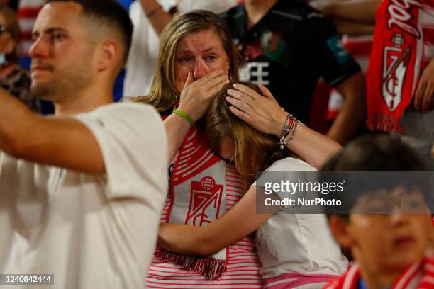 Supporters of GranadaCF cry after Granada CF descends to second division during the La Liga match between Granada CF and RCD Espanyol at Nuevo Los...