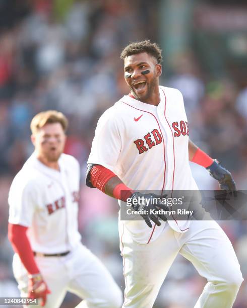 Franchy Cordero of the Boston Red Sox celebrates after hitting a walk-off grand slam in the tenth inning against the Seattle Mariners at Fenway Park...