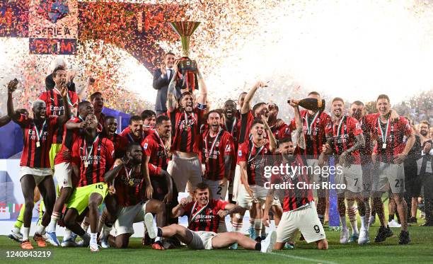 Alessio Romagnoli of AC Milan lifts the Serie A Scudetto trophy after their side finished the season as Serie A champions during the Serie A match...