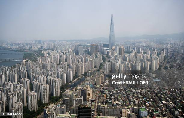 The Lotte World Tower, the tallest building in South Korea and sixth tallest in the world at 123 stories tall, is seen from the air over Seoul, South...
