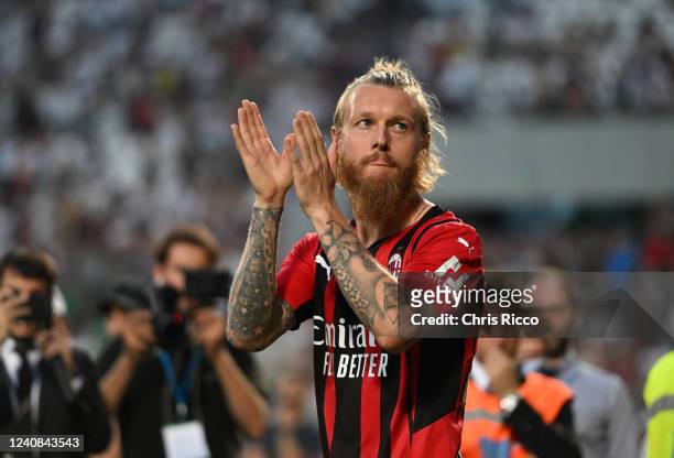 Simon Kjaer of AC Milan celebrates after their side finished the season as Serie A champions during the Serie A match between US Sassuolo and AC...