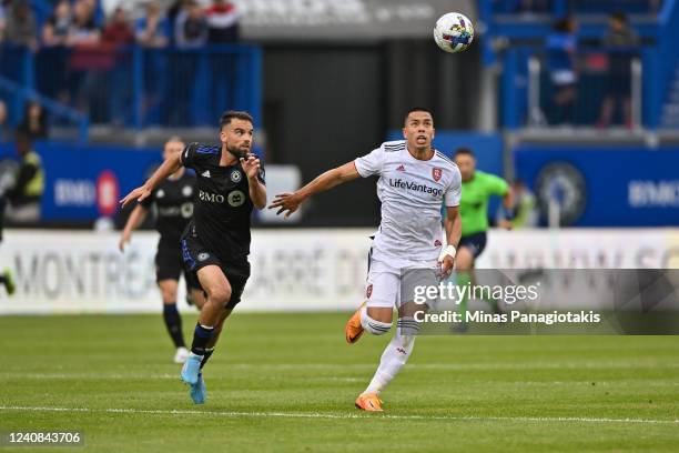 Rudy Camacho of CF Montréal and Bobby Wood of Real Salt Lake run after the ball in the second half at Saputo Stadium on May 22, 2022 in Montreal,...