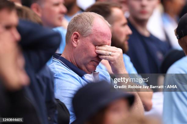 Fan of Manchester City reacts during the Premier League match between Manchester City and Aston Villa at Etihad Stadium on May 22, 2022 in...