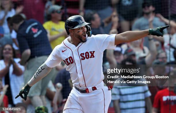 Boston Red Sox's Xander Bogaerts reacts as he rounds the bases after a walk off grand slam by Franchy Cordero during the 10th inning of the game...