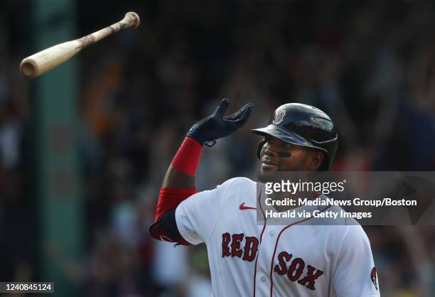 Boston Red Sox's Franchy Cordero tosses his bat after hitting a walk off grand slam during the 10th inning of the game against the Seattle Mariners...
