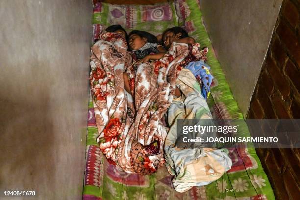 Indigenous children from the Wounaan etnia sleep at a temporary shelter after being displaced from the low Calima river region to the port city of...