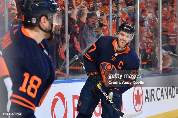 Zach Hyman and Connor McDavid of the Edmonton Oilers celebrate after a goal during Game One of the Second Round of the 2022 Stanley Cup Playoffs...