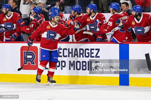 Laval Rocket left wing Danick Martel celebrates his goal with his teammates at the bench during the game 1 of round 3 of the Calder Cup Playoffs...