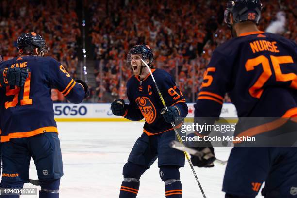 Connor McDavid, Evander Kane and Darnell Nurse of the Edmonton Oilers celebrate a goal against the Calgary Flames during the second period in Game...