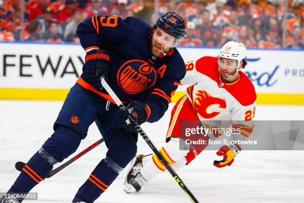 Edmonton Oilers Center Leon Draisaitl is shadowed by Calgary Flames Winger Dillon Dube in the second period during the Edmonton Oilers versus the...