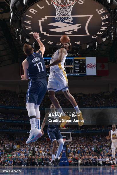 Andrew Wiggins of the Golden State Warriors dunks the ball during Game 3 of the 2022 NBA Playoffs Western Conference Finals against the Dallas...