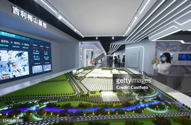 Citizens learn about Geely's future factory at the Yangtze River Delta Manufacturing Digital Capability Center in Xiaoshan District, Hangzhou, May...
