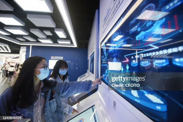 Citizens experience industrial cloud security at the Yangtze River Delta Manufacturing Digital Capability Center in Xiaoshan District of Hangzhou,...