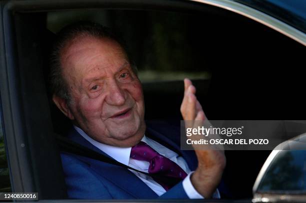 Former king Juan Carlos I of Spain, waves from a car as he arrives at La Zarzuela palace in Madrid, on May 23 to meet with his son, King Felipe VI of...
