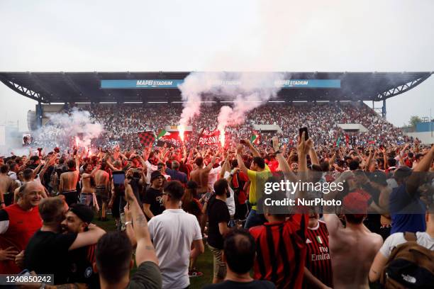 Milan fans invade the pitch after the match to celebrate the SERIE A victory during the italian soccer Serie A match US Sassuolo vs AC Milan on May...