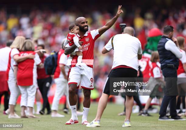 Alexandre Lacazette of Arsenal takes part in a lap of honour after the Premier League match between Arsenal and Everton at Emirates Stadium on May...