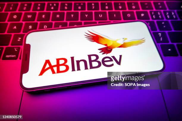In this photo illustration, an Anheuser-Busch InBev logo is displayed on a smartphone.