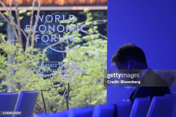 An attendee, wearing a protective face mask, at a panel session on the opening day of the World Economic Forum in Davos, Switzerland, on Monday, May...