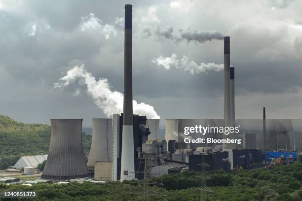 Chimneys and a cooling tower emit vapor at the Scholven coal-fired power plant operated by Uniper SE in Gelsenkirchen, Germany, on Saturday, May 21,...