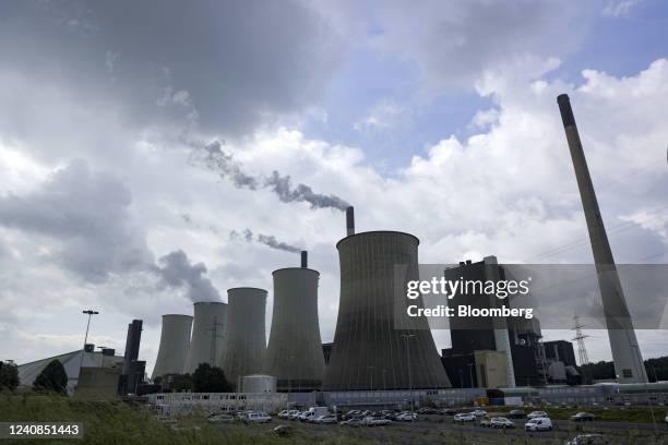 Chimneys and a cooling towers emit vapor at the Scholven coal-fired power plant operated by Uniper SE in Gelsenkirchen, Germany, on Saturday, May 21,...