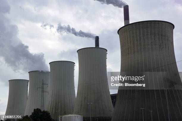 Chimneys and a cooling towers emit vapor at the Scholven coal-fired power plant operated by Uniper SE in Gelsenkirchen, Germany, on Saturday, May 21,...