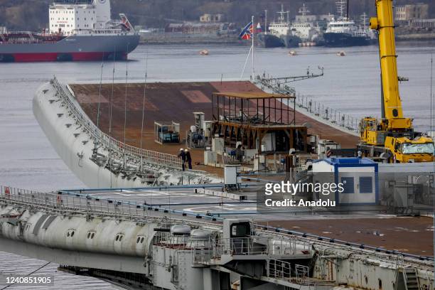 Russian Navyâs lone aircraft carrier, the Admiral Flota Sovetskogo Soyuza Kuznetsov, is towed to the 35th squadron shipyard for maintenance and...