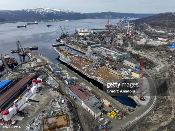 Russian Navyâs lone aircraft carrier, the Admiral Flota Sovetskogo Soyuza Kuznetsov, is towed to the 35th squadron shipyard for maintenance and...