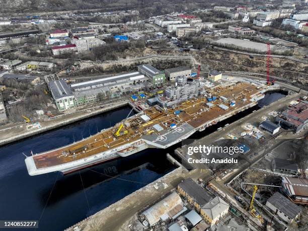 Russian Navyâs lone aircraft carrier, the Admiral Flota Sovetskogo Soyuza Kuznetsov, is towed to the 35th squadron shipyard for maintenance and...