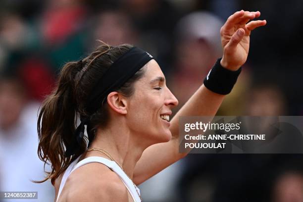 Germany's Andrea Petkovic reacts after winning against France's Oceane Dodin during their women's singles match on day two of the Roland-Garros Open...