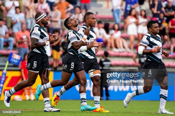 Semi KUNATANI of Fiji, Pipilo BUKAYARO of Fiji, Elia CANAKAIVATA and Tavita DAUGUNU of Fiji during the HSBC World Sevens Series on May 22, 2022 in...