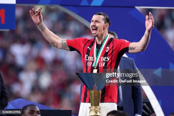 Zlatan Ibrahimovic of AC Milan celebrates with the cup after winning the championship after the Serie A match between US Sassuolo and AC Milan at...