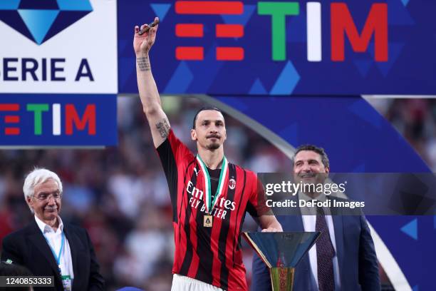 Zlatan Ibrahimovic of AC Milan celebrates with the cup after winning the championship after the Serie A match between US Sassuolo and AC Milan at...