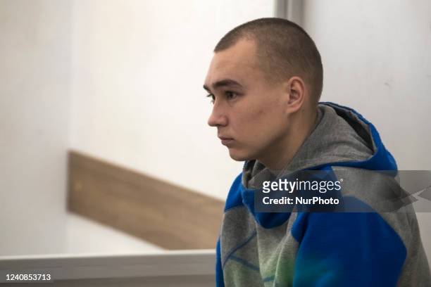 Russian soldier Vadim Shishimarin stands inside a cage after he was sentenced to life in prison by a Ukrainian court for killing an unarmed civilian...