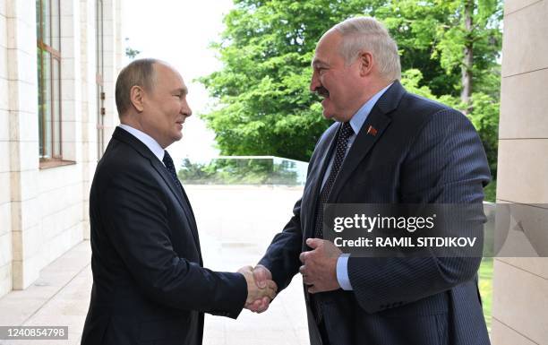 Russian President Vladimir Putin meets with his Belarus' counterpart Alexander Lukashenko in the Black Sea resort of Sochi on May 23, 2022.