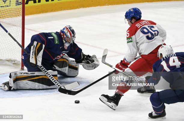 S forward T J Tynan and USA's goalkeeper Jeremy Swayman vie for the ball as Czech Republic's forward Matej Blumel scores during the IIHF Ice Hockey...