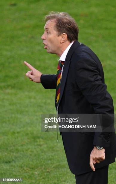 Ghana's coach Milovan Rajevac speaks to his players during their Group D first round 2010 World Cup football match Serbia vs Ghana on June 13, 2010...