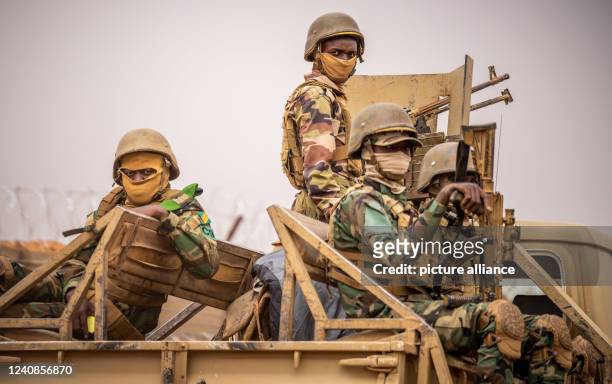May 2022, Niger, Tillia: Nigerian soldiers drive out of Bundeswehr camp in Tillia. Scholz visits Bundeswehr soldiers stationed in Niger to train the...