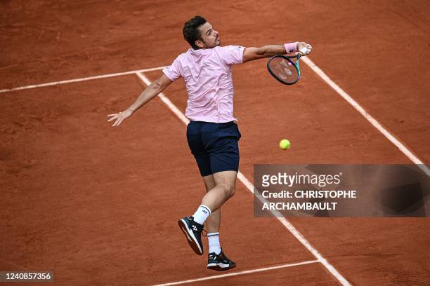 Switzerland's Stan Wawrinka returns the ball to France's Corentin Moutet during their men's singles match on day two of the Roland-Garros Open tennis...