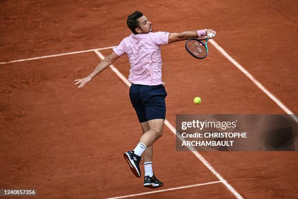 Switzerland's Stan Wawrinka returns the ball to France's Corentin Moutet during their men's singles match on day two of the Roland-Garros Open tennis...