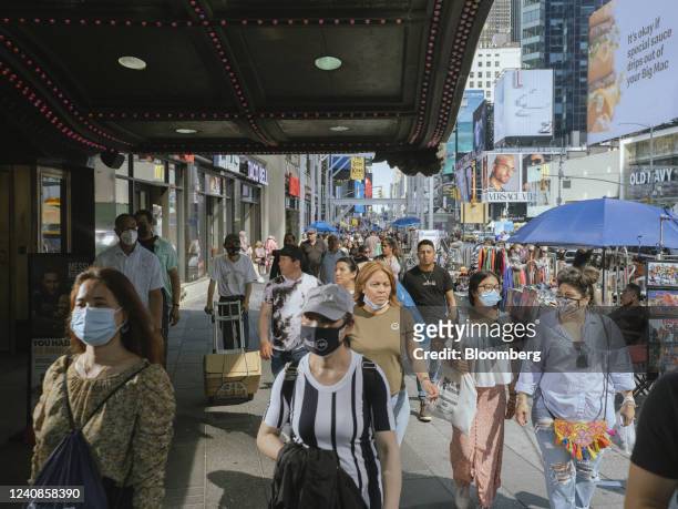 Pedestrians in the Times Square neighborhood of New York, US, on Sunday, May 22, 2022. New York City has raised its Covid-19 alert level to high amid...
