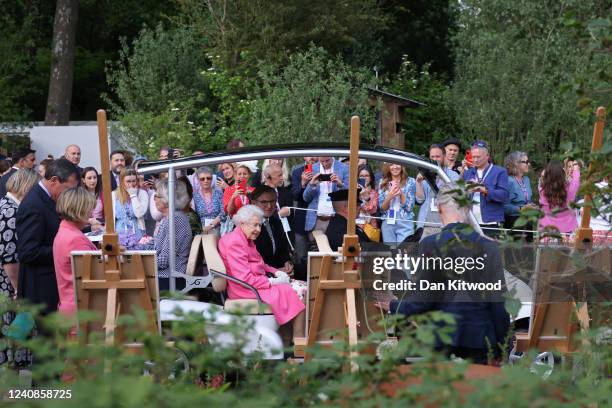 Queen Elizabeth II is given a tour during a visit to The Chelsea Flower Show 2022 at the Royal Hospital Chelsea on May 23, 2022 in London, England....
