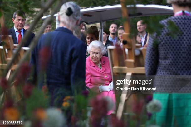 Queen Elizabeth II is given a tour during a visit to The Chelsea Flower Show 2022 at the Royal Hospital Chelsea on May 23, 2022 in London, England....