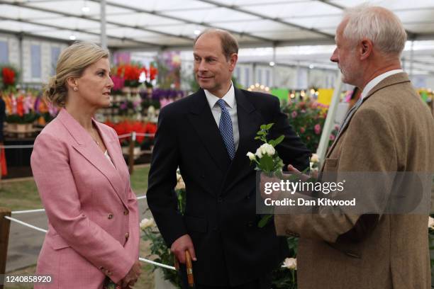 Sophie, Countess of Wessex and Prince Edward, Earl of Wessex are shown the Ystumllyn rose on the 'Harkness Roses' stand on May 23, 2022 in London,...