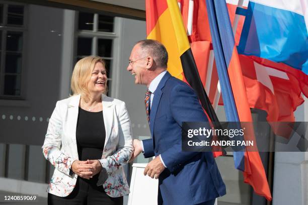 German Interior Minister Nancy Faeser laughs with her Austrian Counterpart Gerhard Karner at the Jewish Museum where she meets with her counterparts...